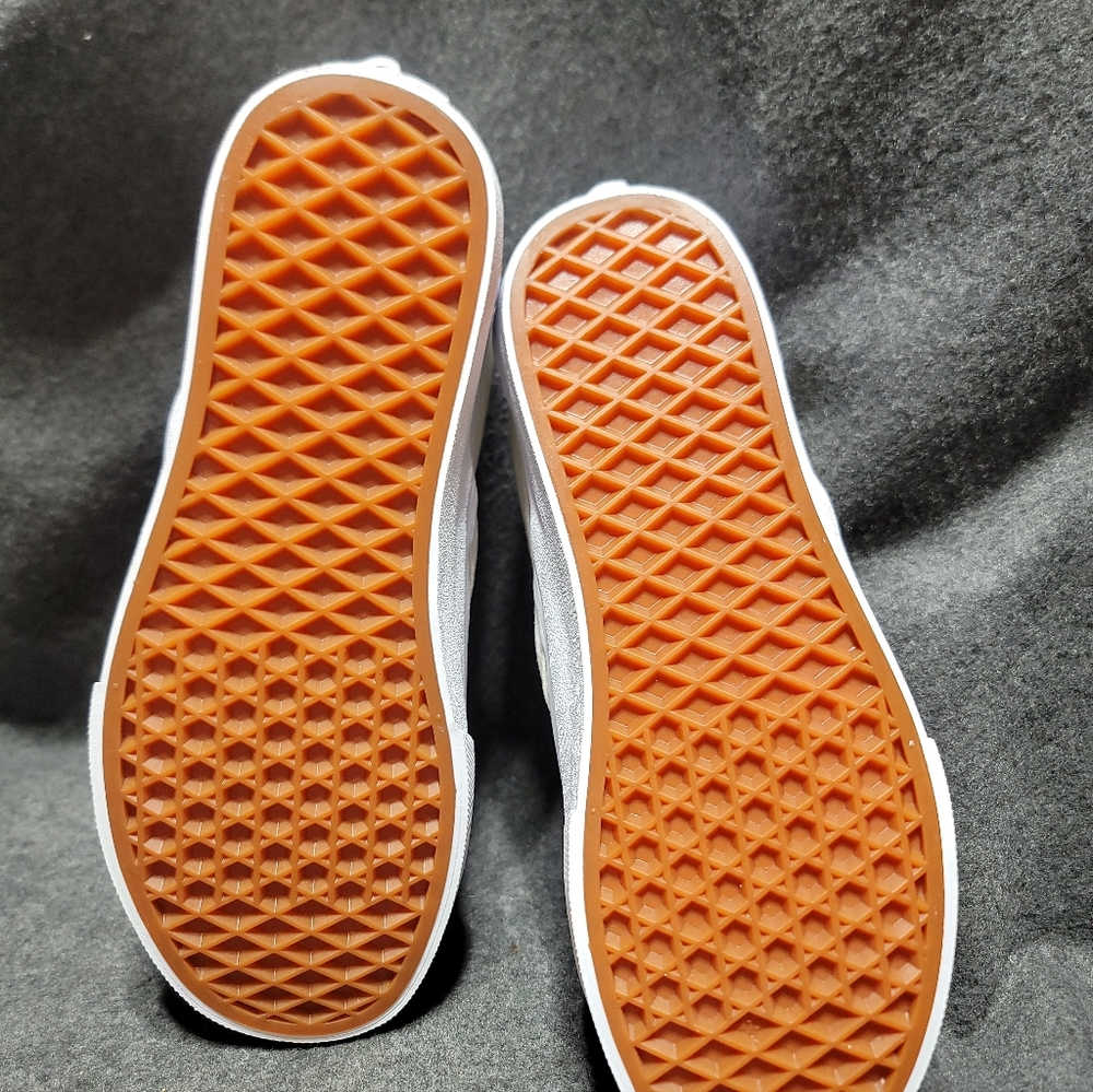 Vans Slip-On Skate shoe in a white color with a reflective checkerboard pattern. - Picture 3 of 5